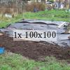 An allotment plot with plastic tarpaulin covering a section of soil
